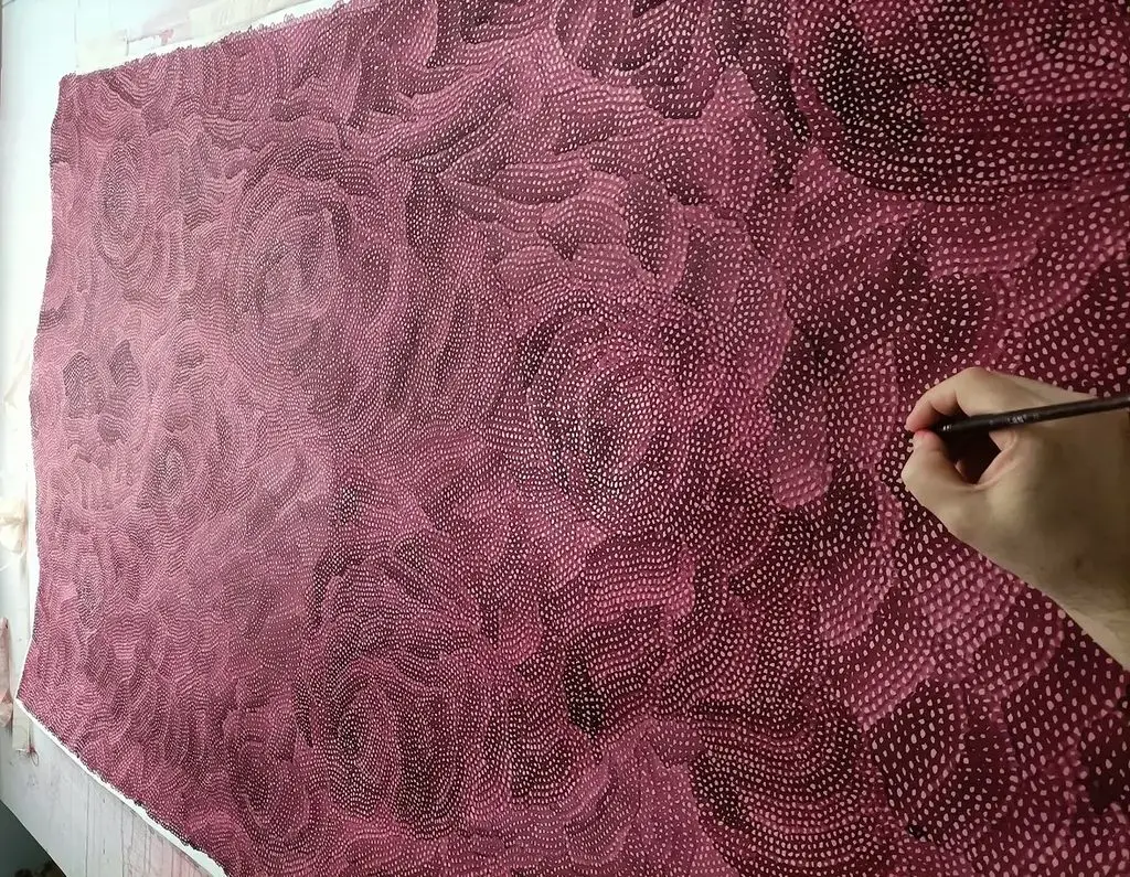 Detail of treated red wine on paper